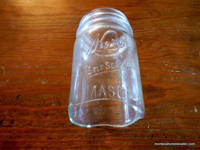 Blown out bottom of a canning jar caused by crack in the bottom of the jar | Montana Homesteader