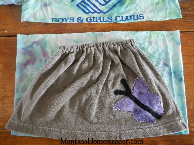 How to make a skirt out of a t shirt for girls by using another skirt as a pattern to cut the t shirt using the already existing hem and side seam so there is less sewing needed